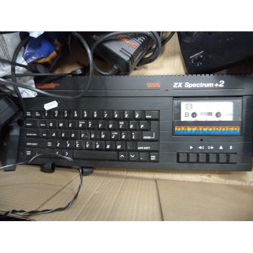 151 - Amstrad Notepad computer, Sega Master System II, ZX Spectrum +2 computer, assorted games etc.