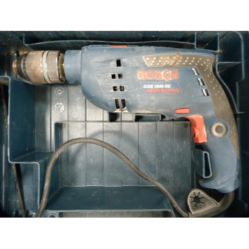 154 - Bosch GSB 1600 RE Professional drill and a Black & Decker jigsaw.  (2)