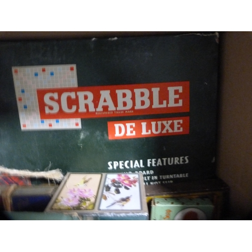 176 - Box of miscellaneous games to include  travel Scrabble, backgammon, playing cards, chess, jigsaws, d... 