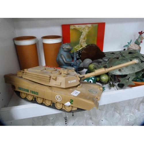 178 - Toys to include a tank, also frog and chicken ornaments, carpet-style bowls, bellows etc (one shelf)... 