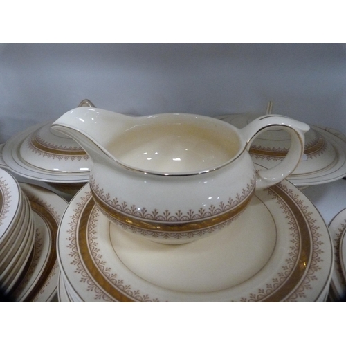 202 - Extensive New Hall gilt decorated dinner service and a pink and gilt part tea set (one shelf).