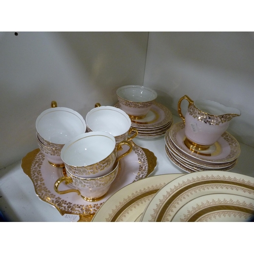 202 - Extensive New Hall gilt decorated dinner service and a pink and gilt part tea set (one shelf).