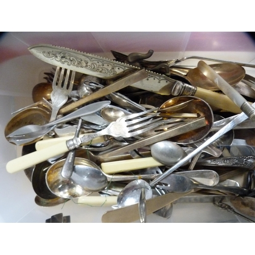 214 - Carton containing loose cutlery to include mother of pearl-handled cutlery and other flatware.