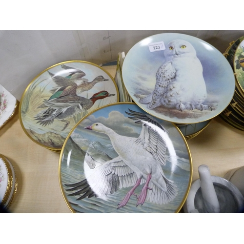 223 - Large quantity of collector's plates, some Limoges, mostly decorated with animals and birds.