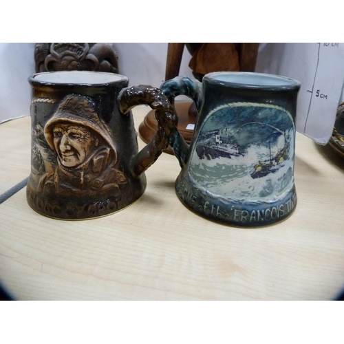 231 - Tribal-style figure, Great Yarmouth Pottery tankards, and an oriental-style tobacco jar.  (4)