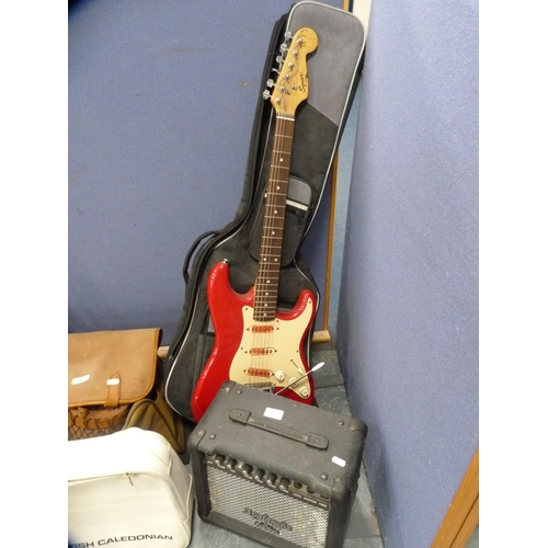 24 - Fender Squire Bullet Strat electric guitar on stand with Freshman Avalanche practice amplifier.