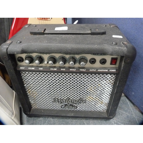 24 - Fender Squire Bullet Strat electric guitar on stand with Freshman Avalanche practice amplifier.