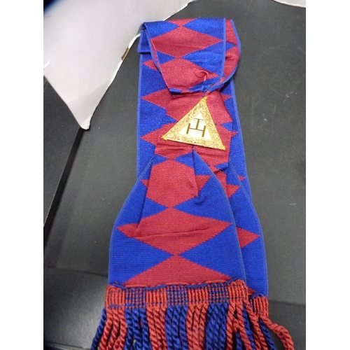 244 - Group of Masonic regalia to include apron, sashes, ties, badges and ephemera.