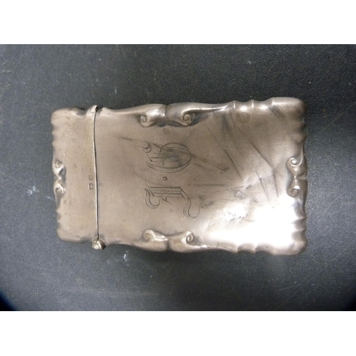 257 - Small silver cigarette case and a silver card case, 108.5g gross.