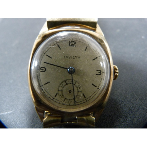 261 - 9ct gold-backed vintage gent's Invicta watch on a flexible bracelet, 34.2g gross.