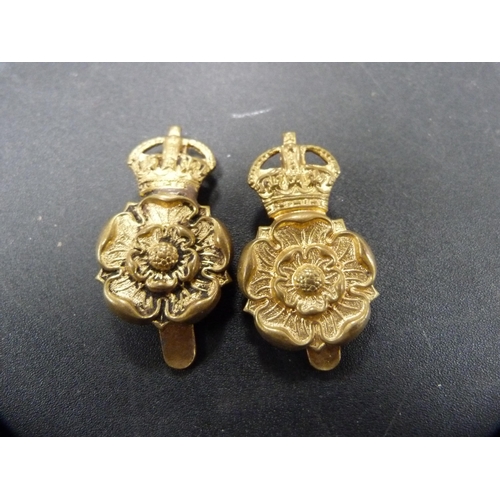 267 - Group of military cap badges, similar cloth badge and buttons.