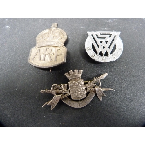 267 - Group of military cap badges, similar cloth badge and buttons.