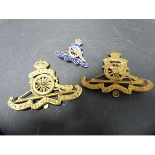 267 - Group of military cap badges, similar cloth badge and buttons.