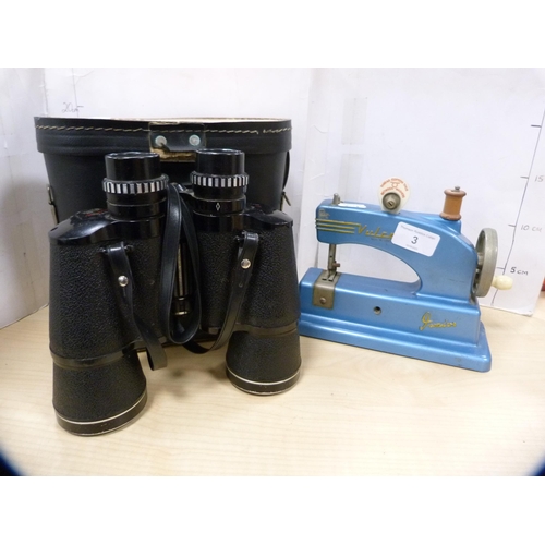 3 - Vulcan child's sewing machine and a pair of binoculars.