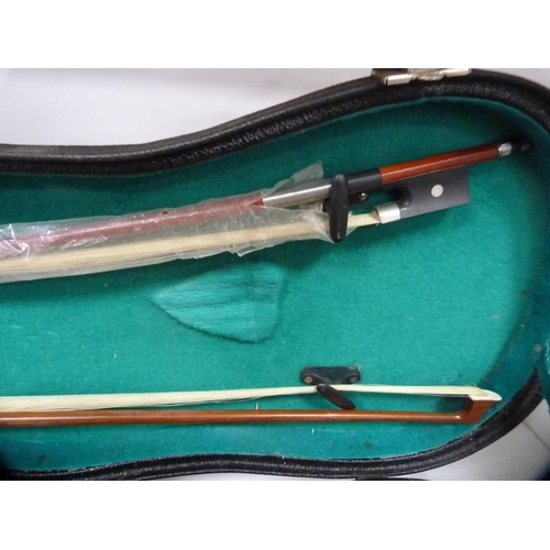 307 - Chinese violin and two bows, in fitted case (one shelf).