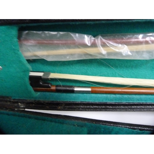 307 - Chinese violin and two bows, in fitted case (one shelf).