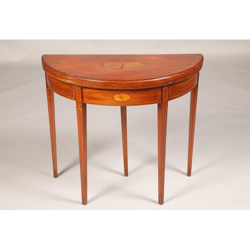 466 - Inlaid mahogany demi lune fold over games table with blue blaze, raised on square tapered legs, leng... 