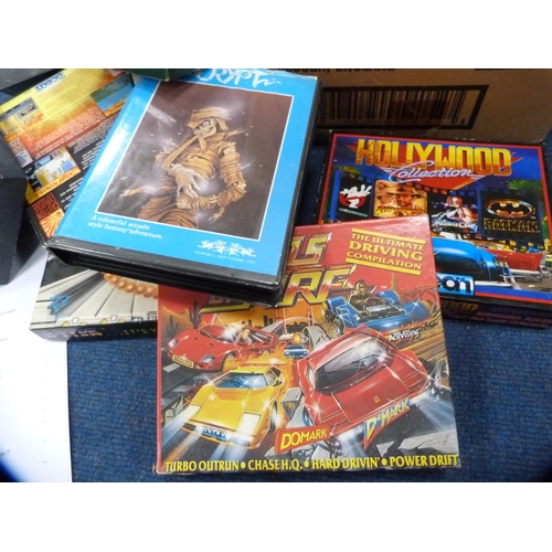 310 - Carton of diecast models to include Dinky and Corgi, and a box of ZX Spectrum games.