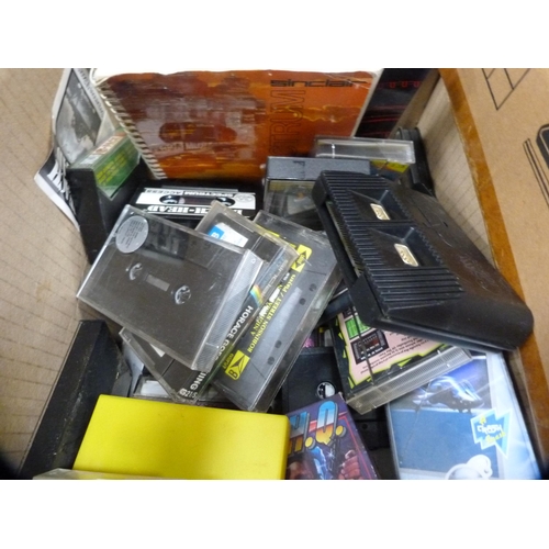 310 - Carton of diecast models to include Dinky and Corgi, and a box of ZX Spectrum games.