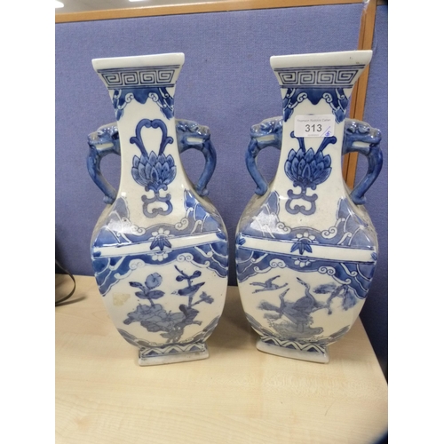 313 - Pair of modern Chinese blue and white vases, a pair of Chinese-style glazed temple dogs and a Japane... 