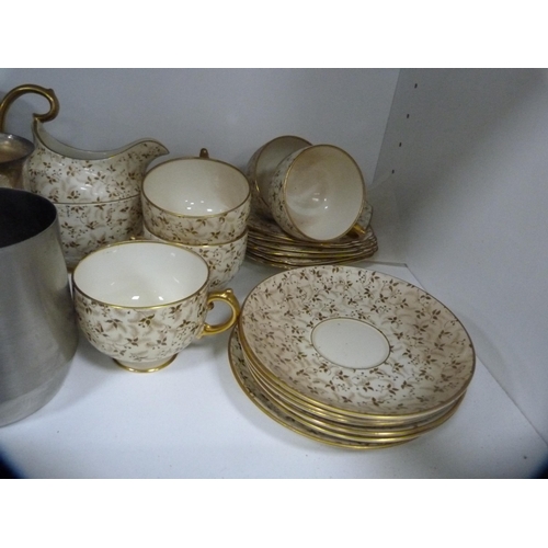 317 - Quantity of ceramic and plated tankards, and a part Grosvenor tea set (one shelf).