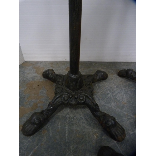 338 - Three cast iron pub-style table bases.