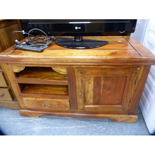 350 - LG television with remote on a wooden TV stand.