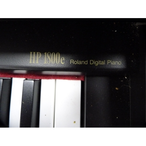 352 - Roland digital piano, HP1800E, with stool and a selection of sheet music.