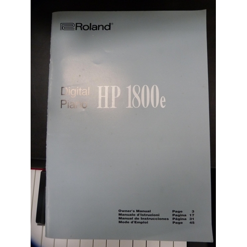 352 - Roland digital piano, HP1800E, with stool and a selection of sheet music.