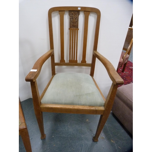 366 - Carved oak carver chair with central motif, a single chair and another.  (3)