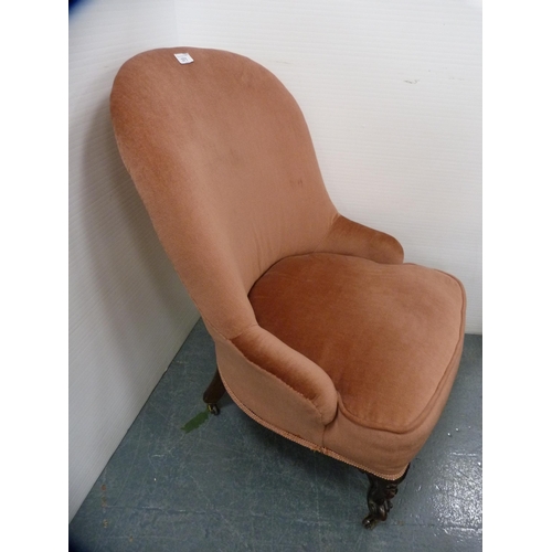 371 - Victorian mahogany nursing chair with later pink velour upholstery.