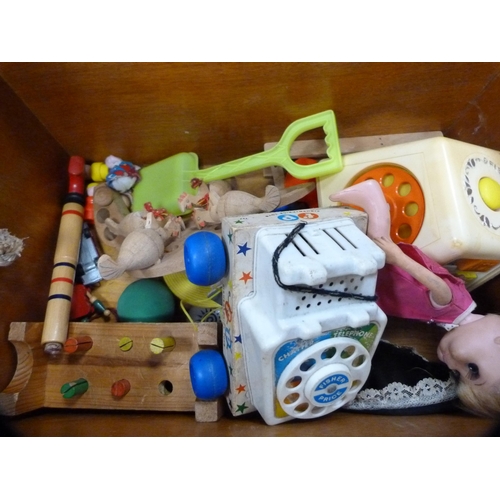 38 - Wooden pull-along child's trolley containing toys etc.