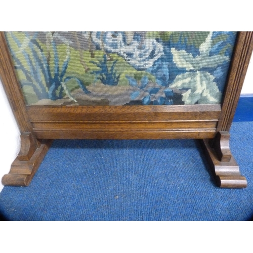 403 - Embroidered oak-framed fire screen.