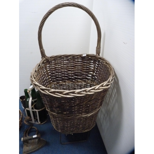 408 - Wicker trolley, flat iron, horseshoes, contemporary sconce and green glass bottles in a holder.