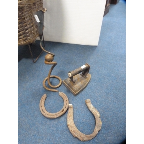 408 - Wicker trolley, flat iron, horseshoes, contemporary sconce and green glass bottles in a holder.