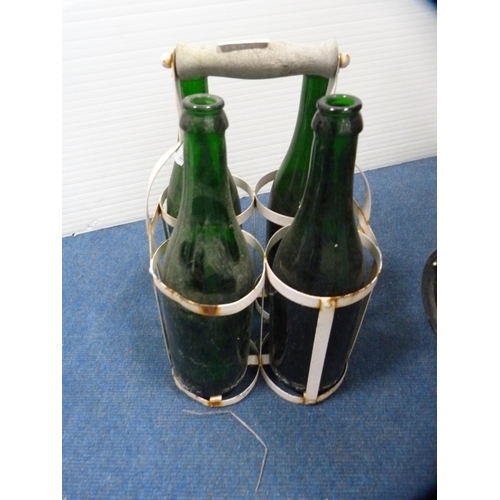 408 - Wicker trolley, flat iron, horseshoes, contemporary sconce and green glass bottles in a holder.