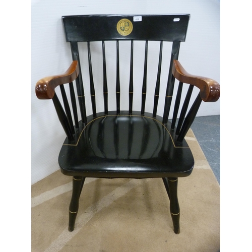 418 - Ebonised spindle-back elbow chair, crested.