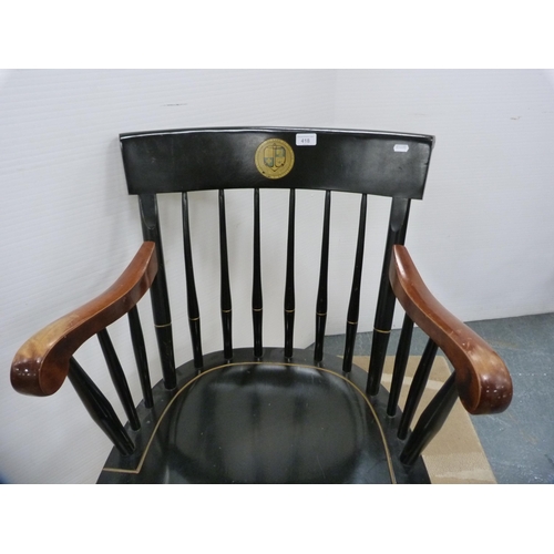 418 - Ebonised spindle-back elbow chair, crested.