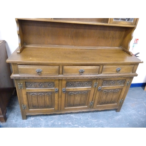 421 - Ercol ten-piece dining suite comprising a unit, table and eight chairs.