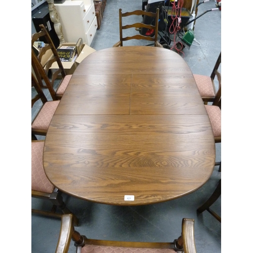 421 - Ercol ten-piece dining suite comprising a unit, table and eight chairs.