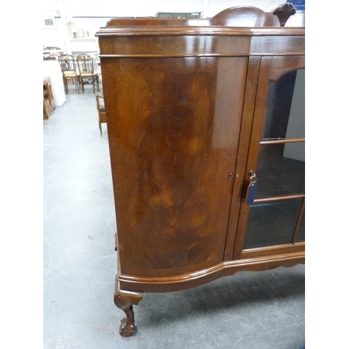 425 - Mahogany display cabinet flanked by two panel door cupboards on cabriole supports.