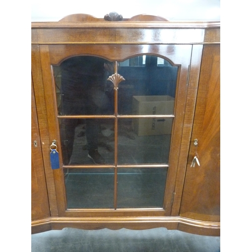 425 - Mahogany display cabinet flanked by two panel door cupboards on cabriole supports.