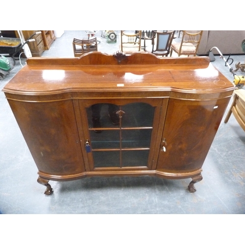 425 - Mahogany display cabinet flanked by two panel door cupboards on cabriole supports.