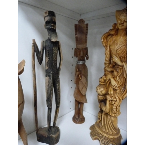 57 - Quantity of African-style wooden tribal and animal figures, and an oak-cased mantel clock etc (one s... 