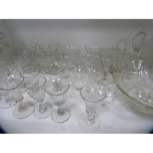 63 - Collection of glassware including spiral glasses, jugs, bowl, dishes etc (one shelf).