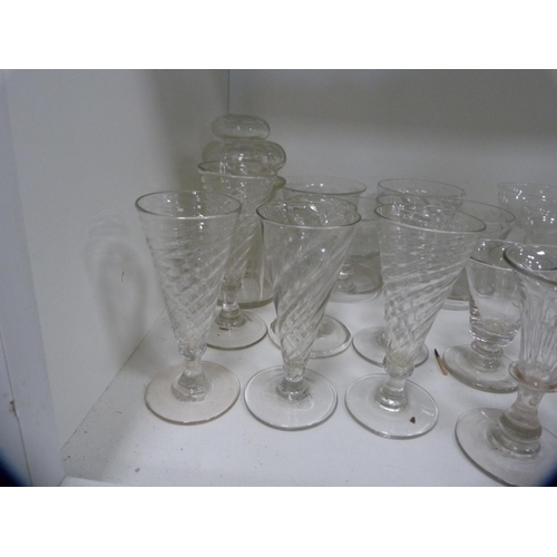 63 - Collection of glassware including spiral glasses, jugs, bowl, dishes etc (one shelf).