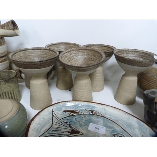 64 - Collection of studio pottery including goblets, soup bowls, wall tiles etc (one shelf).