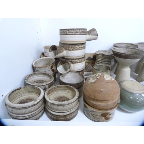 64 - Collection of studio pottery including goblets, soup bowls, wall tiles etc (one shelf).