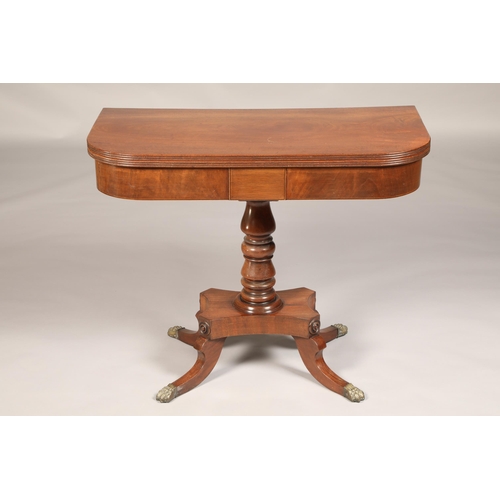 480 - Regency mahogany fold over tea table, raised on a turned pedestal on a quadraform base with out swep... 