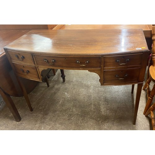 499 - Mahogany bow front desk with fitted drawrs122 cm long 59 cm wide 84 cm high